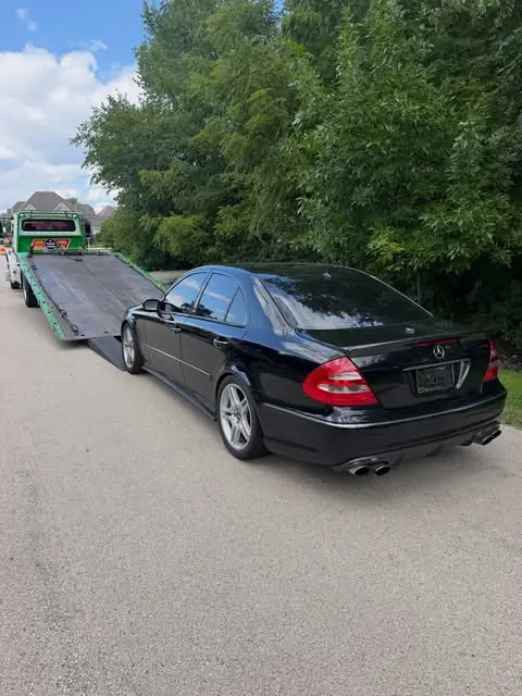 Mercedes sedan towed by PS Towing & Recovery
